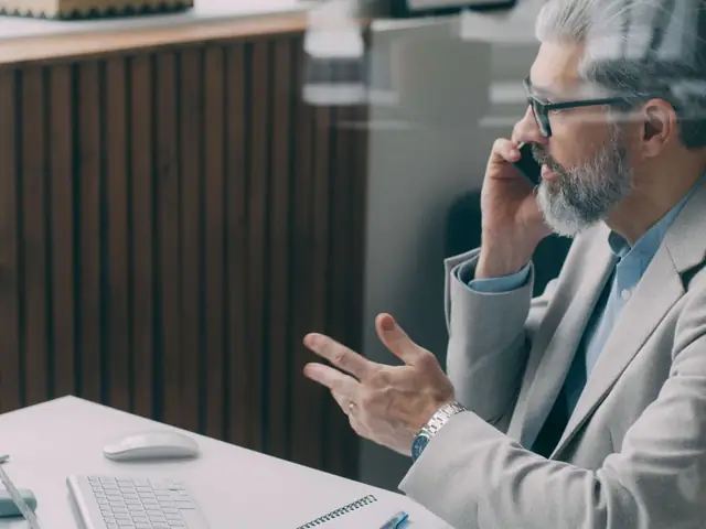 Business owner on a phone call at his desk